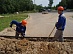 Students from a construction crew take part in the work on grid connection of a filling station in Smolensk